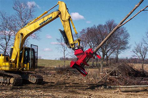 felling a tree with mini excavator|how to pull trees with excavators.